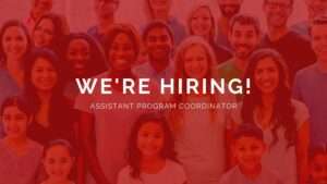 A red background with a multicultural group of people behind the words "We're hiring! Assistant Program Coordinator"